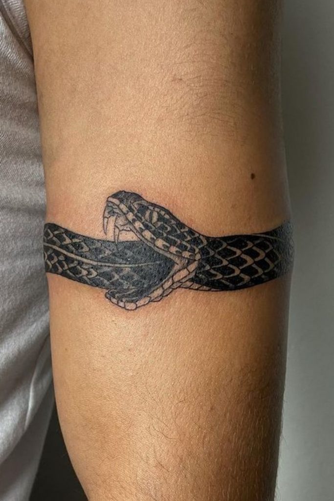 Meaning Of Snake Eating Itself Tattoo