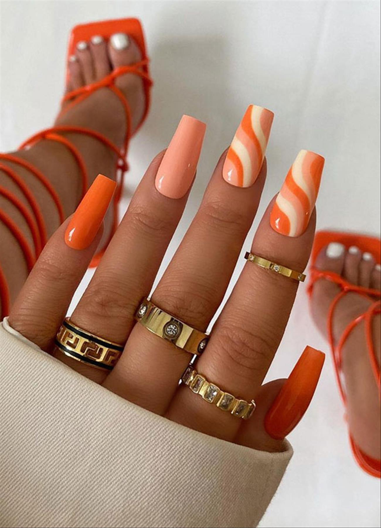 Bright Neon orange nails for summer nail colors 2022