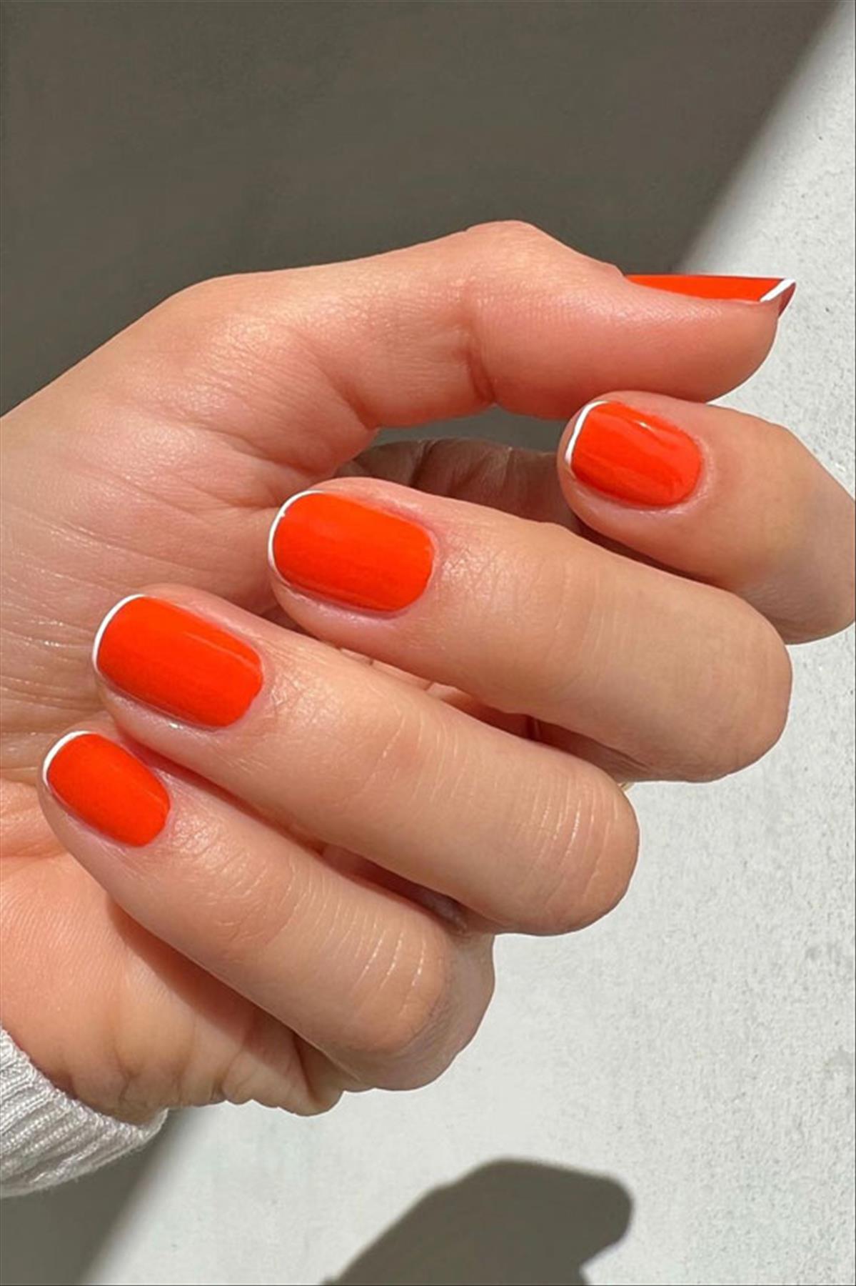 Bright Neon orange nails for summer nail colors 2022