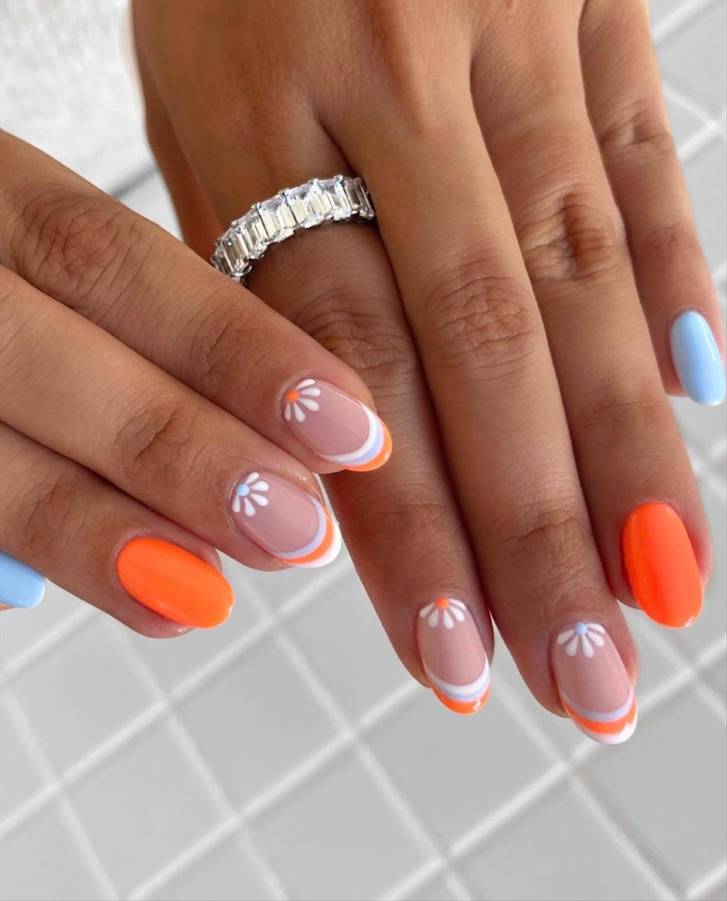 Bright Neon orange nails for summer nail colors 2022