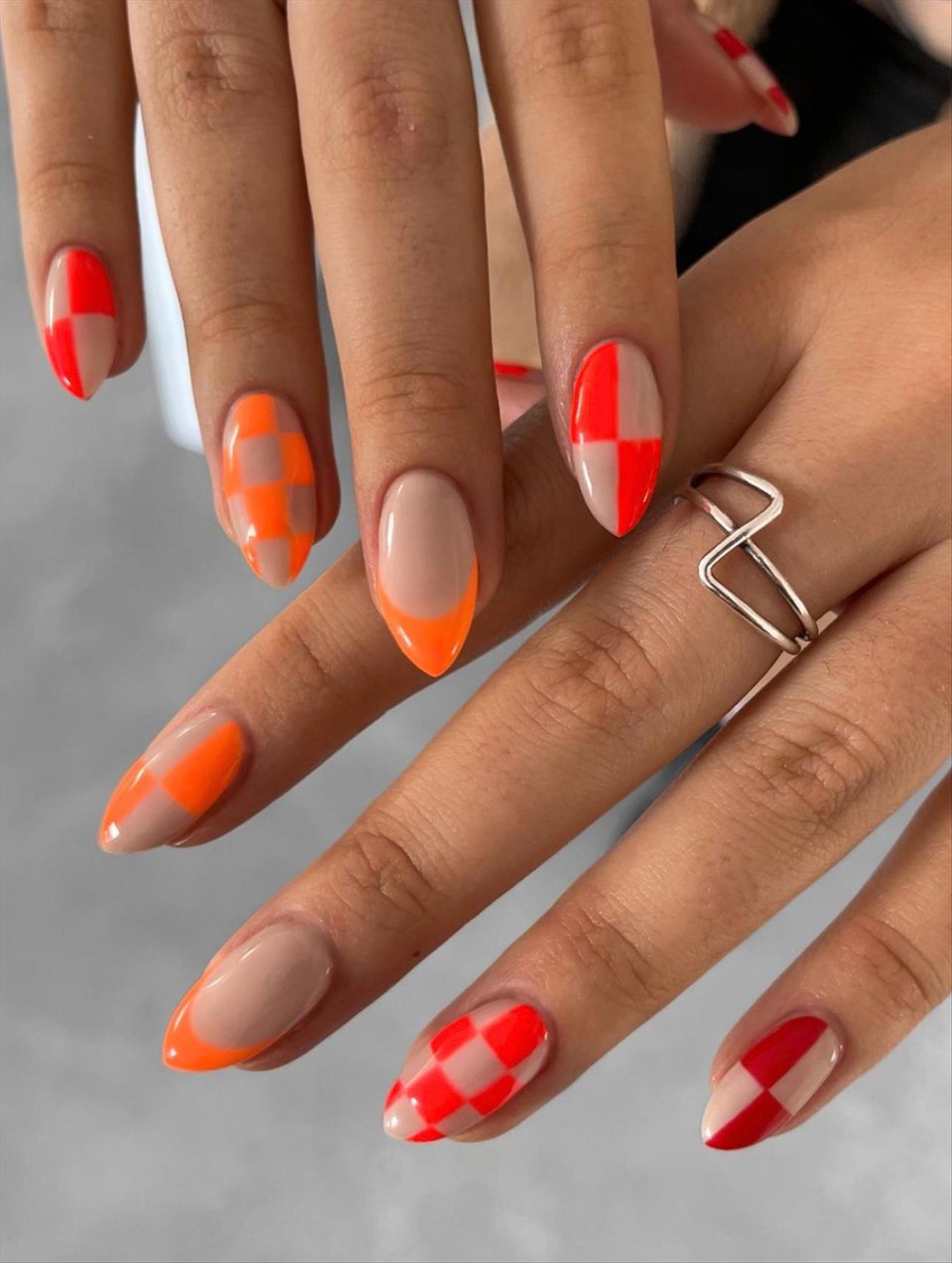 Bright Neon orange nails for summer nail colors 2022