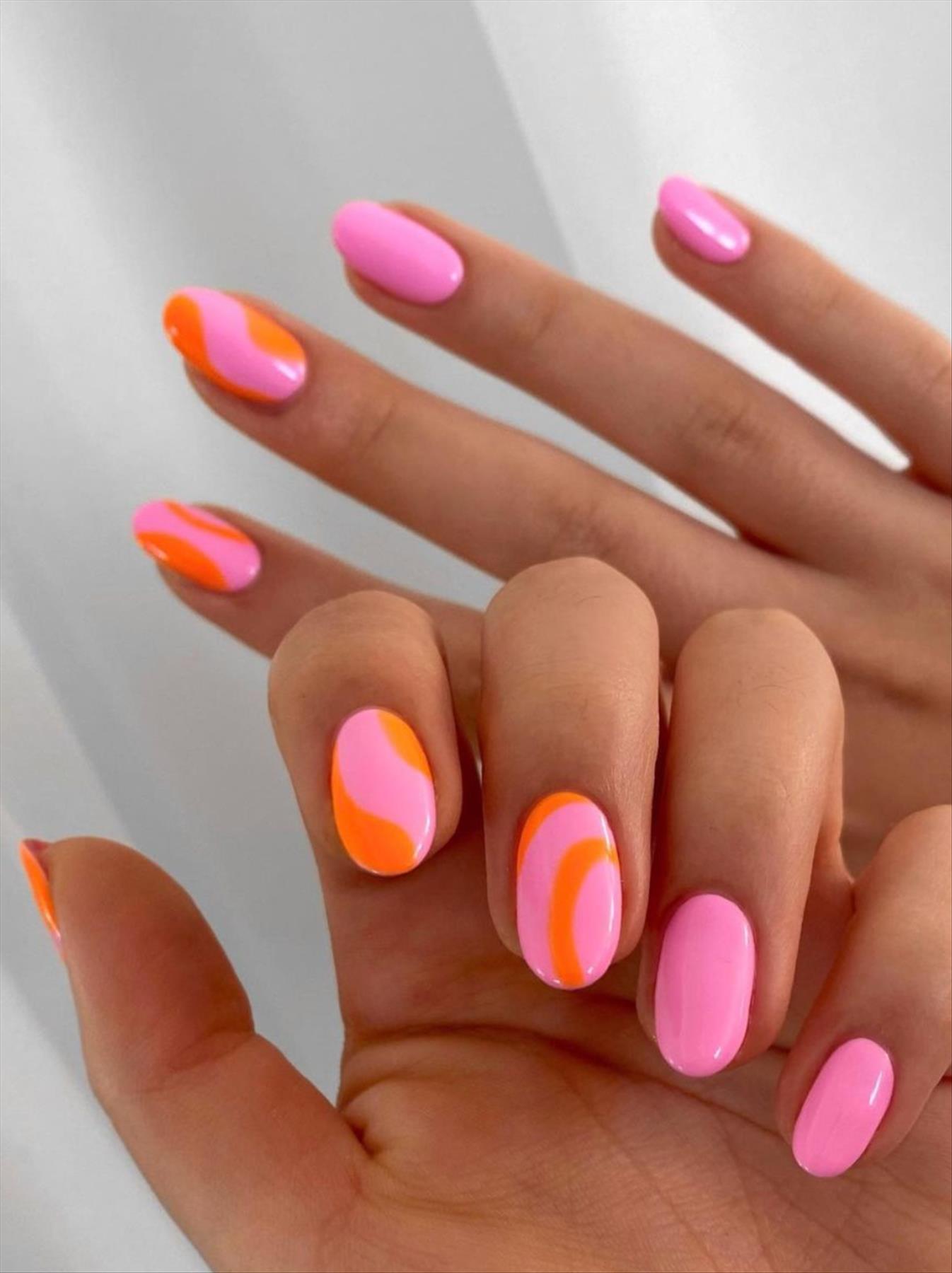 Bright Neon orange nails for summer nail colors 2022