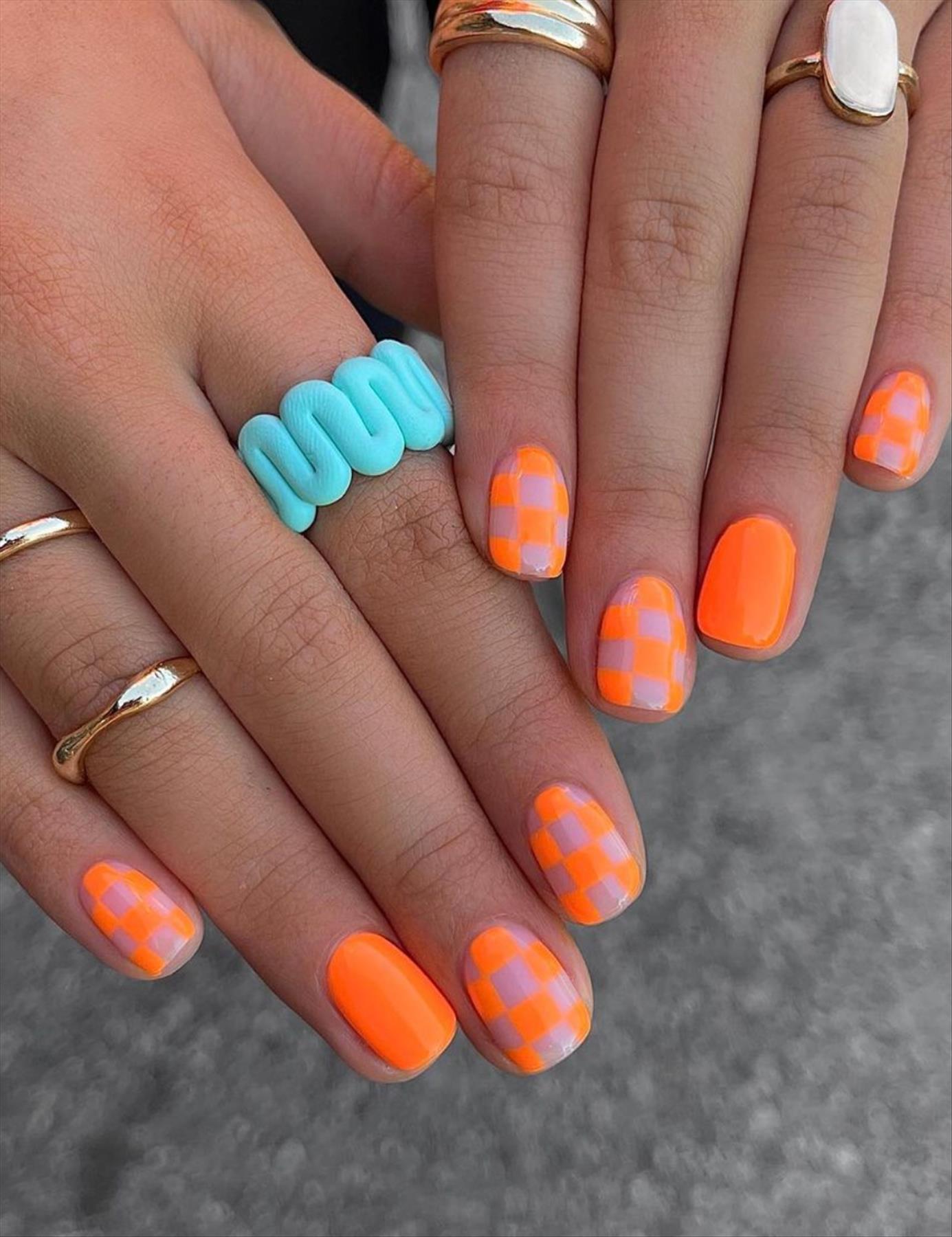 Bright Neon orange nails for summer nail colors 2022