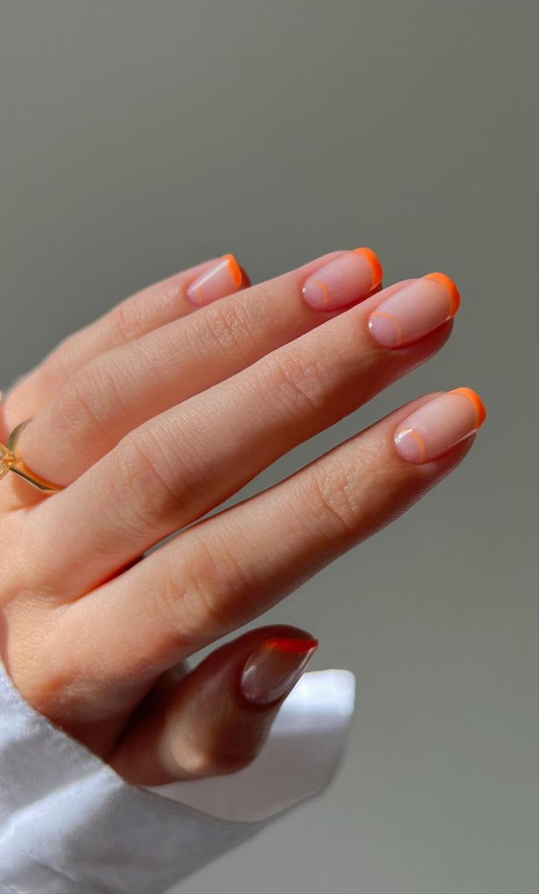 Bright Neon orange nails for summer nail colors 2022