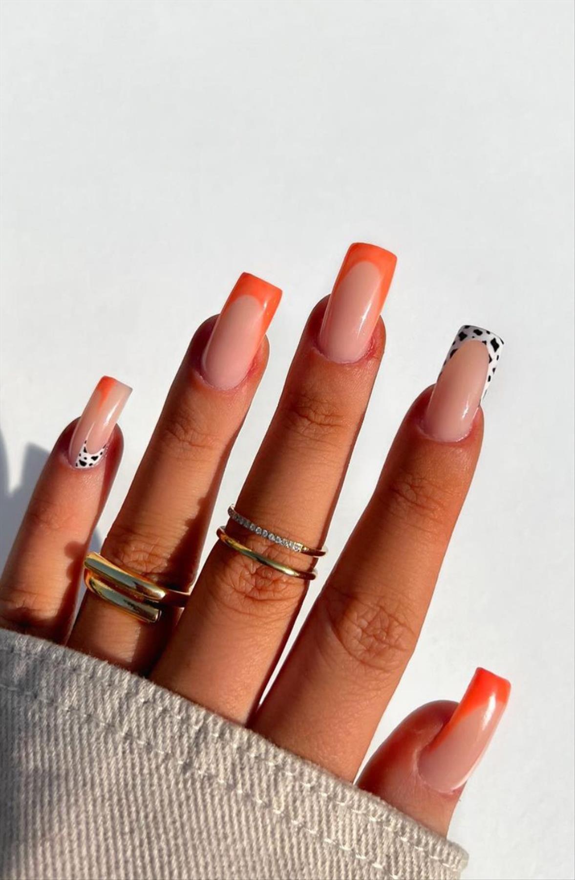 Bright Neon orange nails for summer nail colors 2022