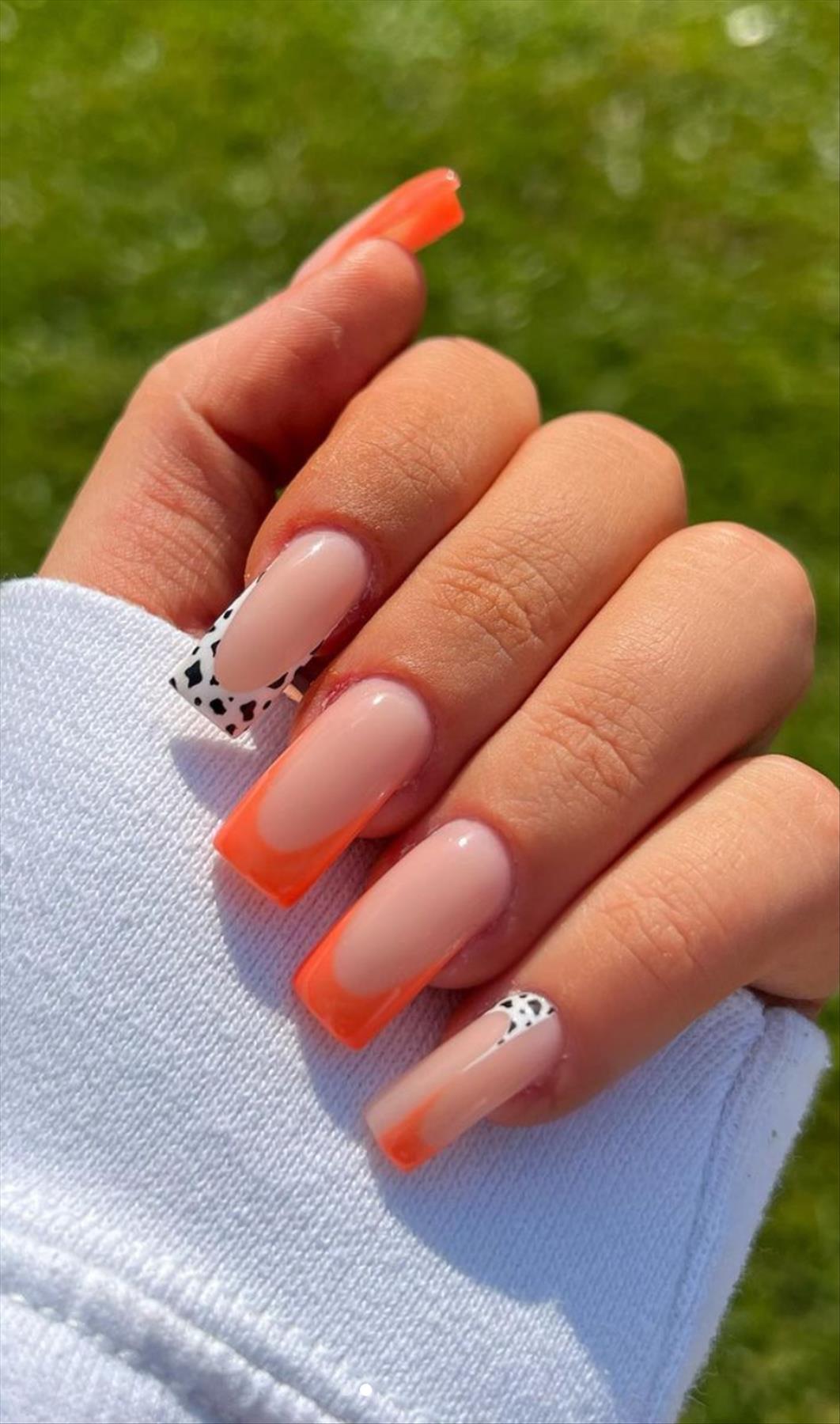 Bright Neon orange nails for summer nail colors 2022