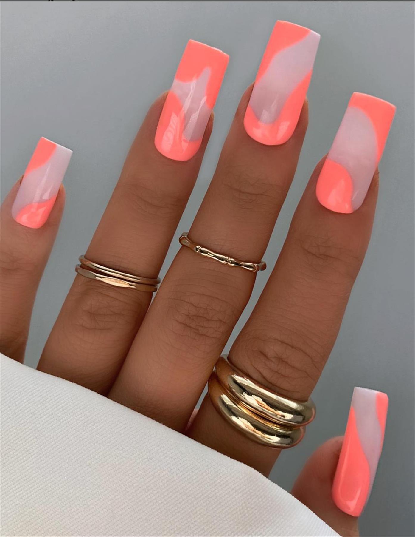 Bright Neon orange nails for summer nail colors 2022