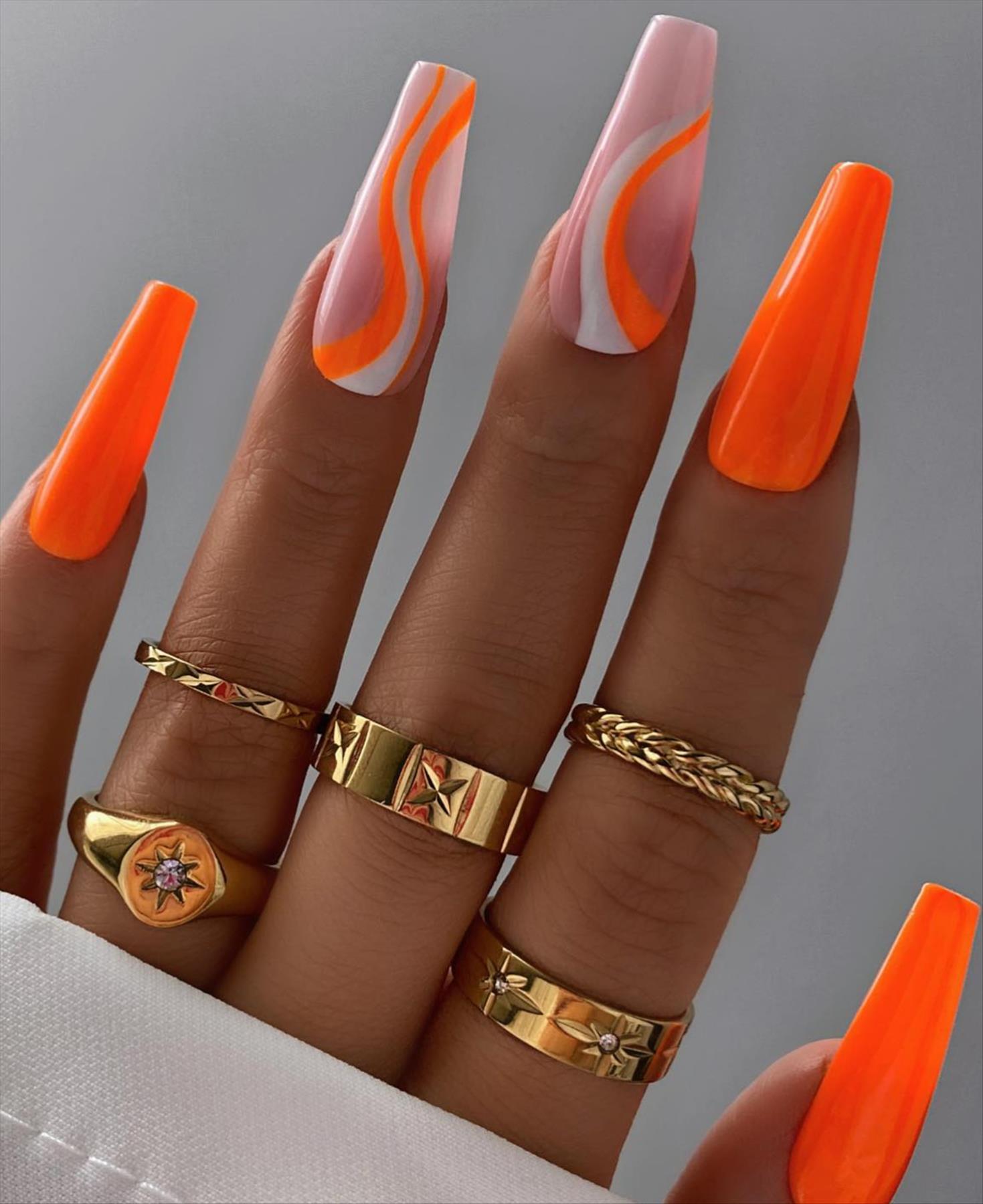 Bright Neon orange nails for summer nail colors 2022