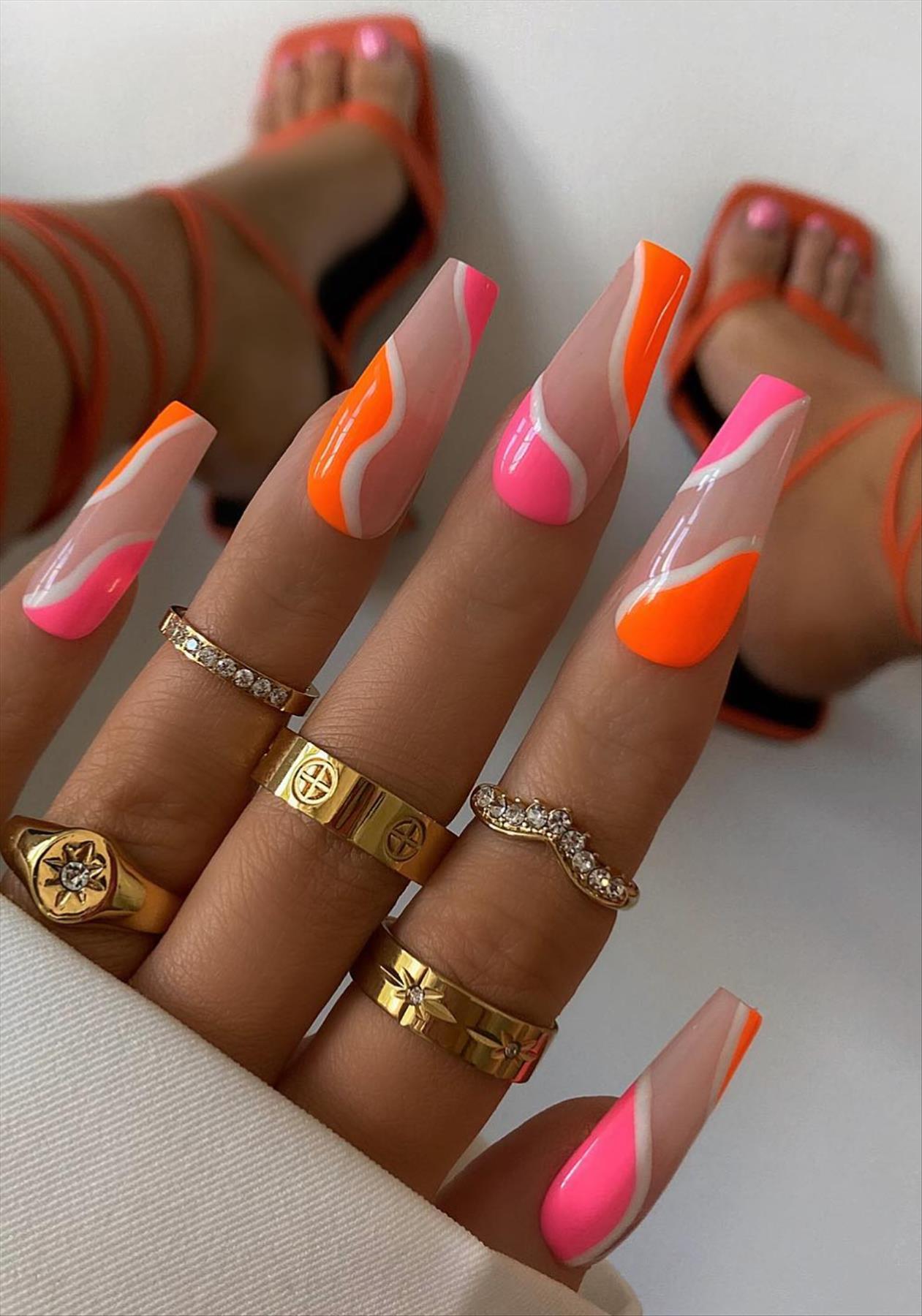 Bright Neon orange nails for summer nail colors 2022