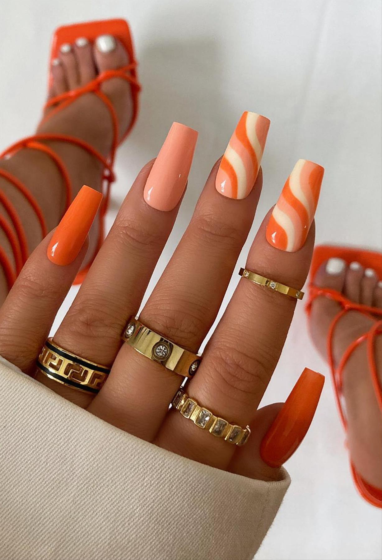 Bright Neon orange nails for summer nail colors 2022