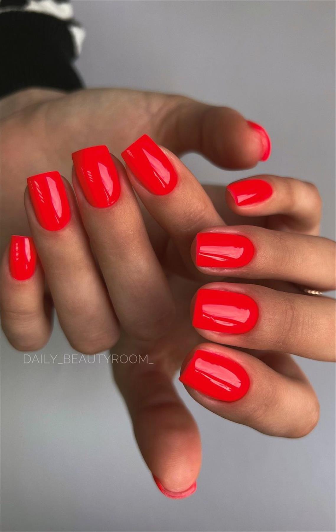 Bright Neon orange nails for summer nail colors 2022