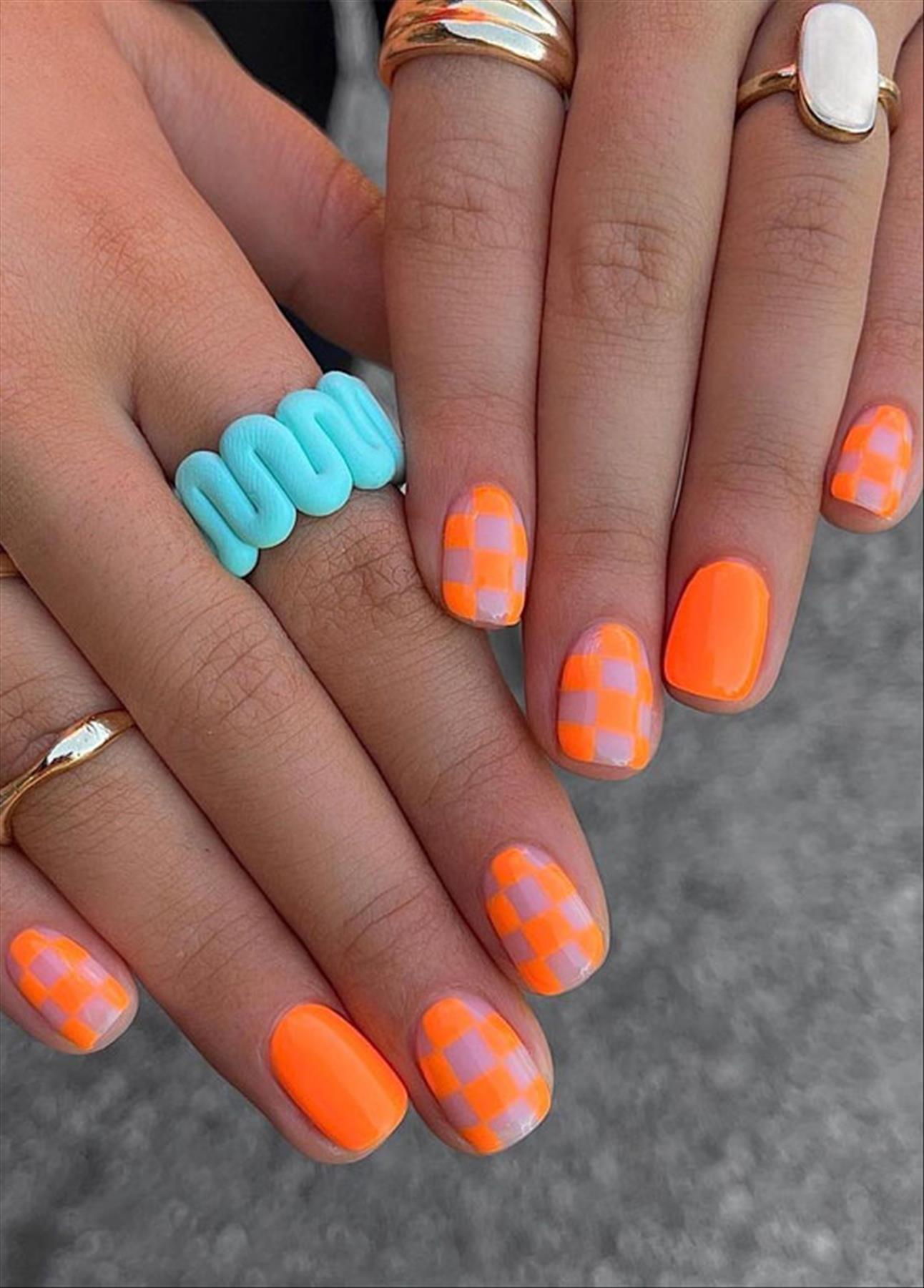 Bright Neon orange nails for summer nail colors 2022