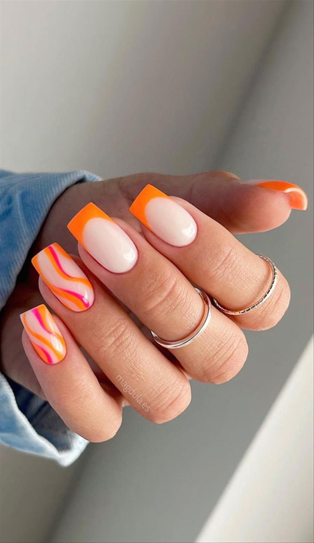 Bright Neon orange nails for summer nail colors 2022