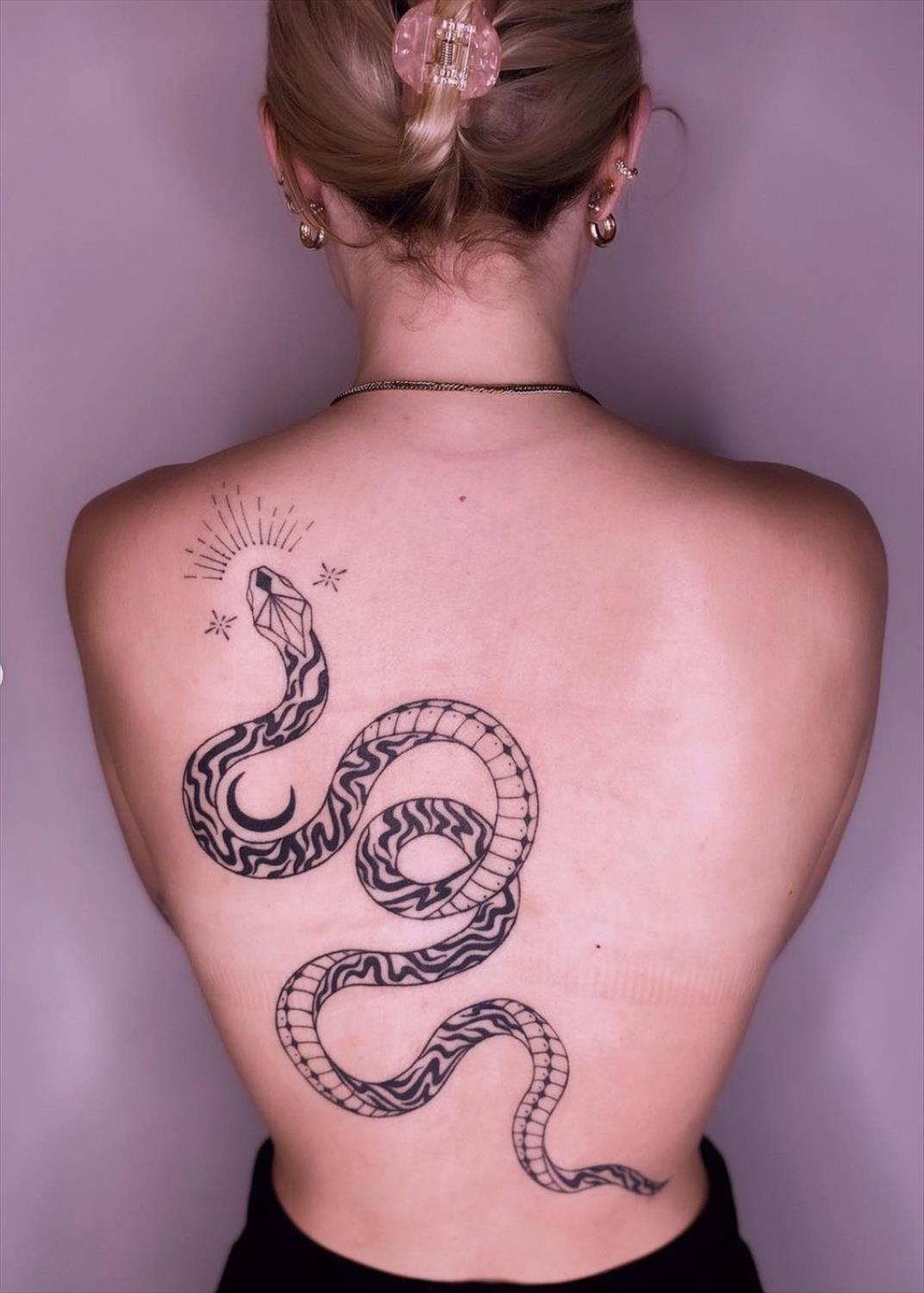 Unique and Charming Back Tattoo Designs for Women