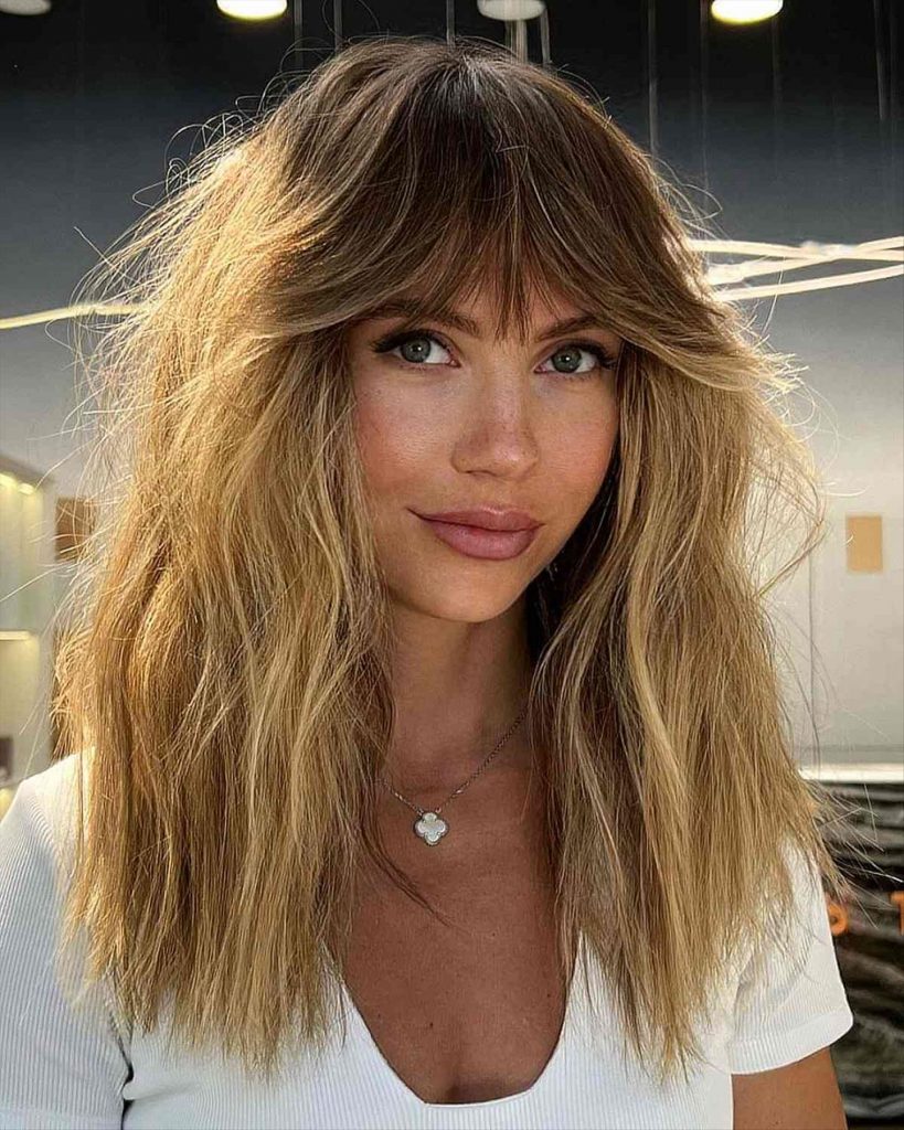 Stylish shaggy haircuts with bangs for girls with big foreheads